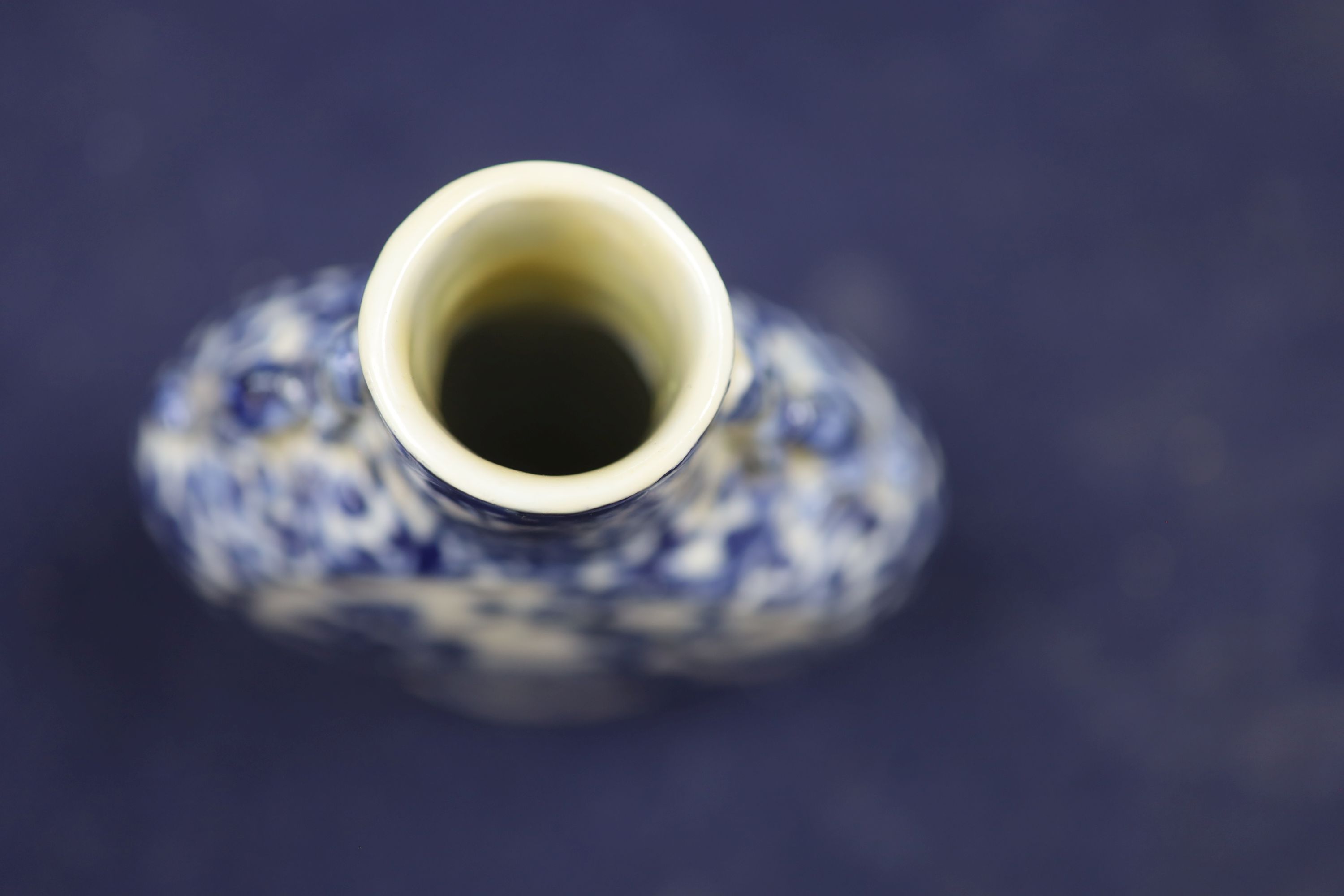 Two 19th century Chinese blue and white moon flasks and a teapot, tallest 21cm